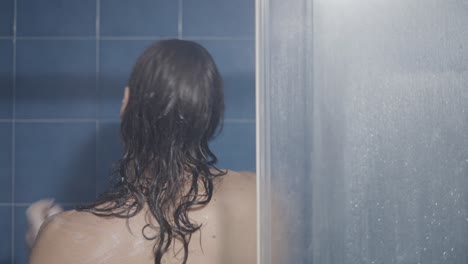 man showering in a bathroom