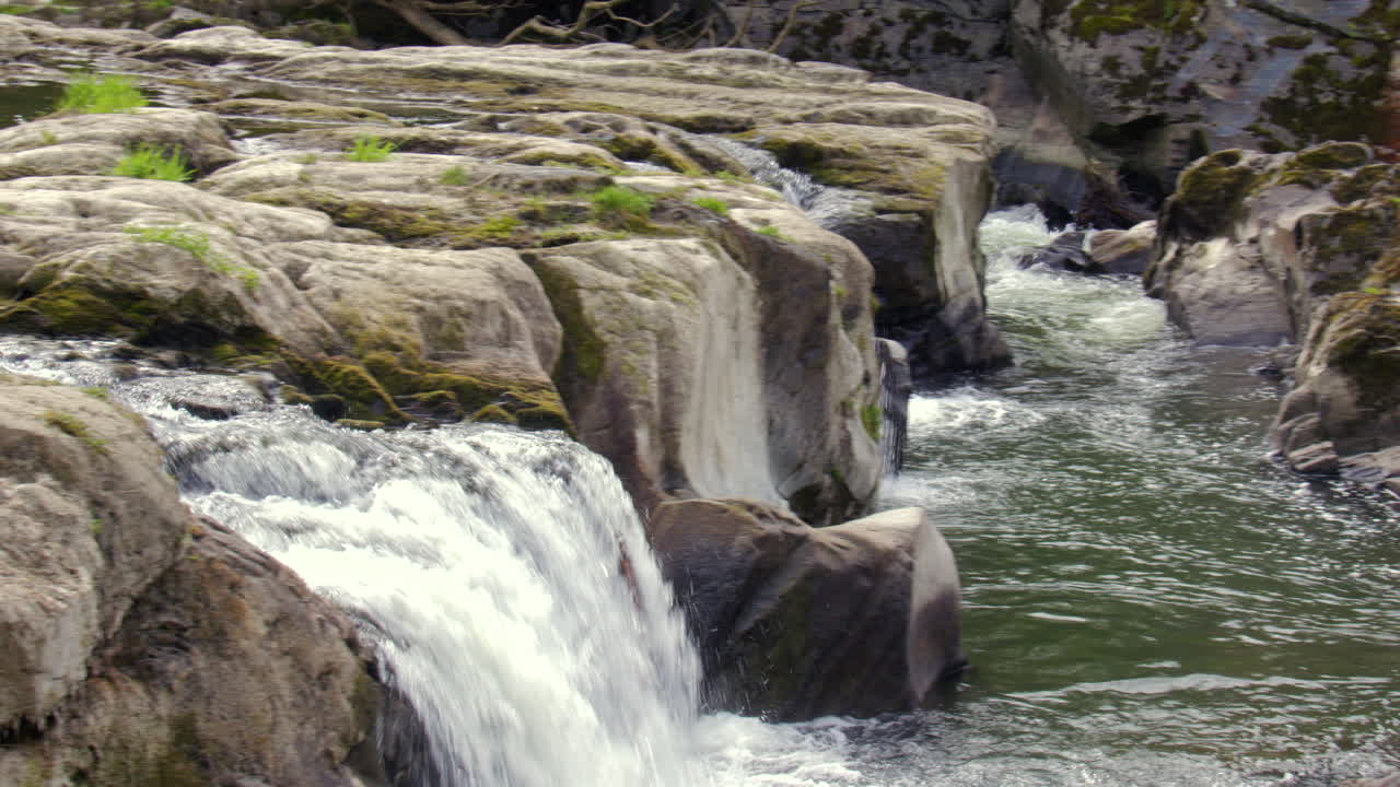 Panning shot of the Cenarth Falls on the river Teifi