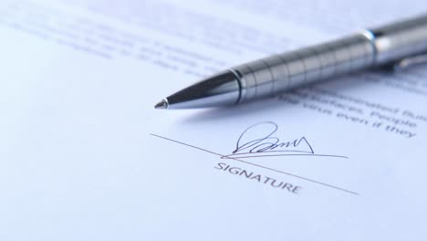 signed document with pen