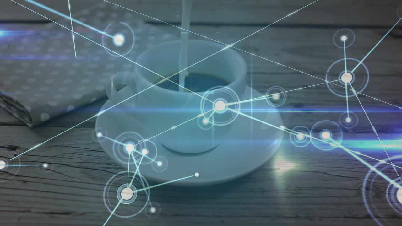 Milk pouring into white ceramic coffee cup on wooden table showing glowing data network overlay