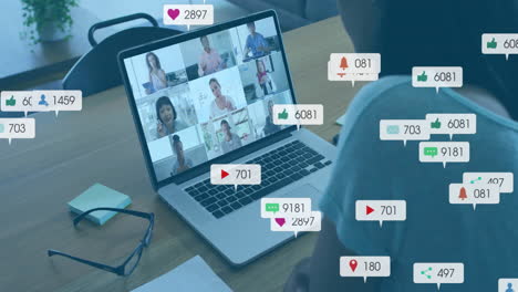 woman viewing business meeting at desk, showing floating likes comments shares notifications