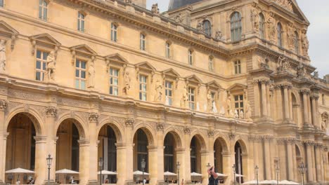 view of exterior architectural details of louvre museum in paris, france during daytime. 4k.