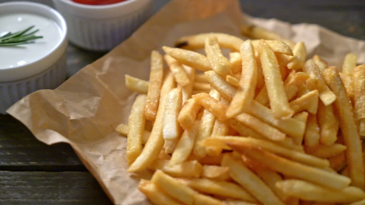 Premium stock video French fries or potato chips with sour cream and
