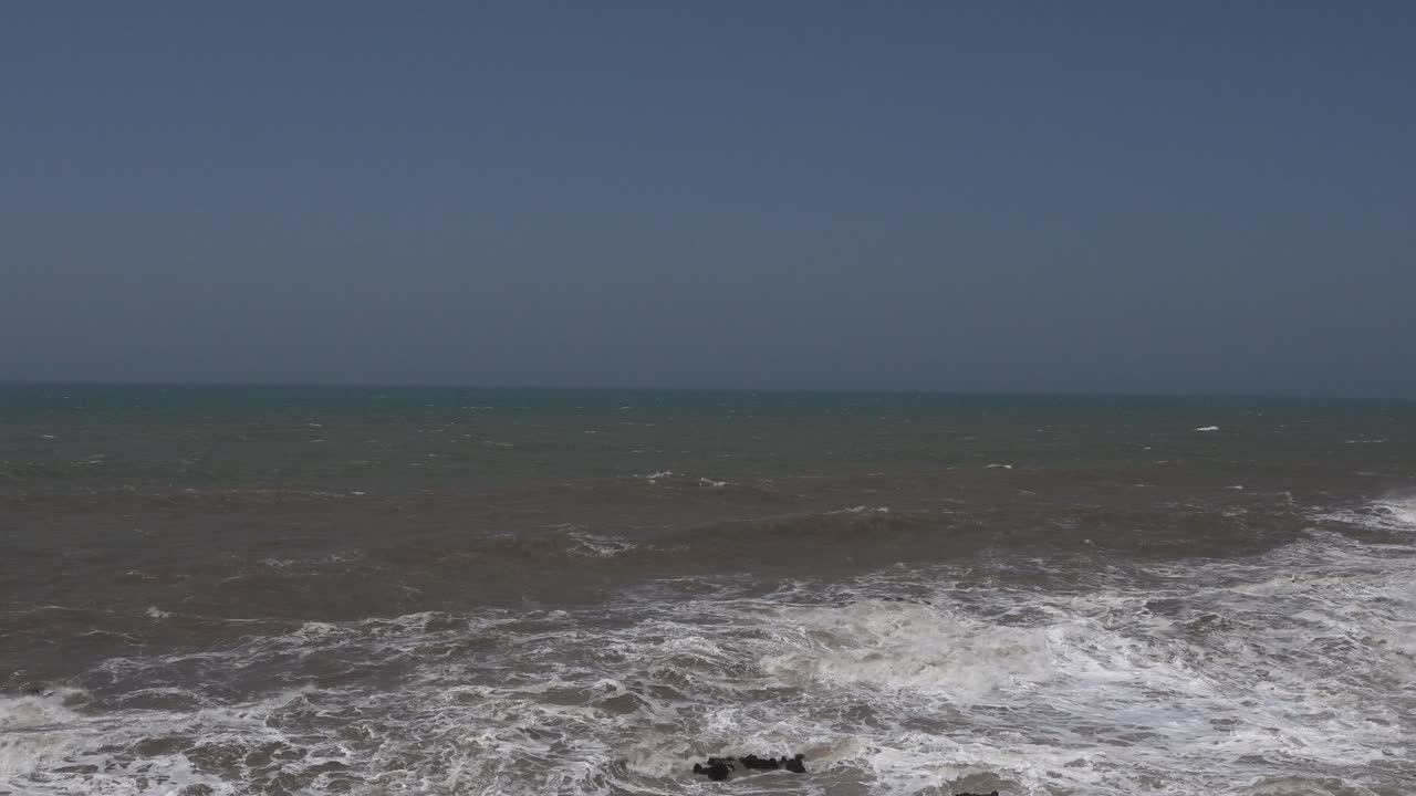 Water as far as the eye can see under a cloudless blue sky. The coolest part is watching the waves move in all directions under the effect of the wind