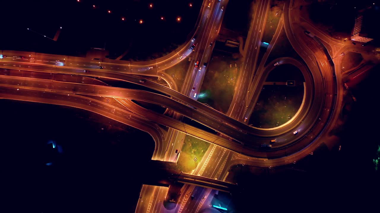 Night Aerial view of a freeway intersection traffic trails in night Moscow