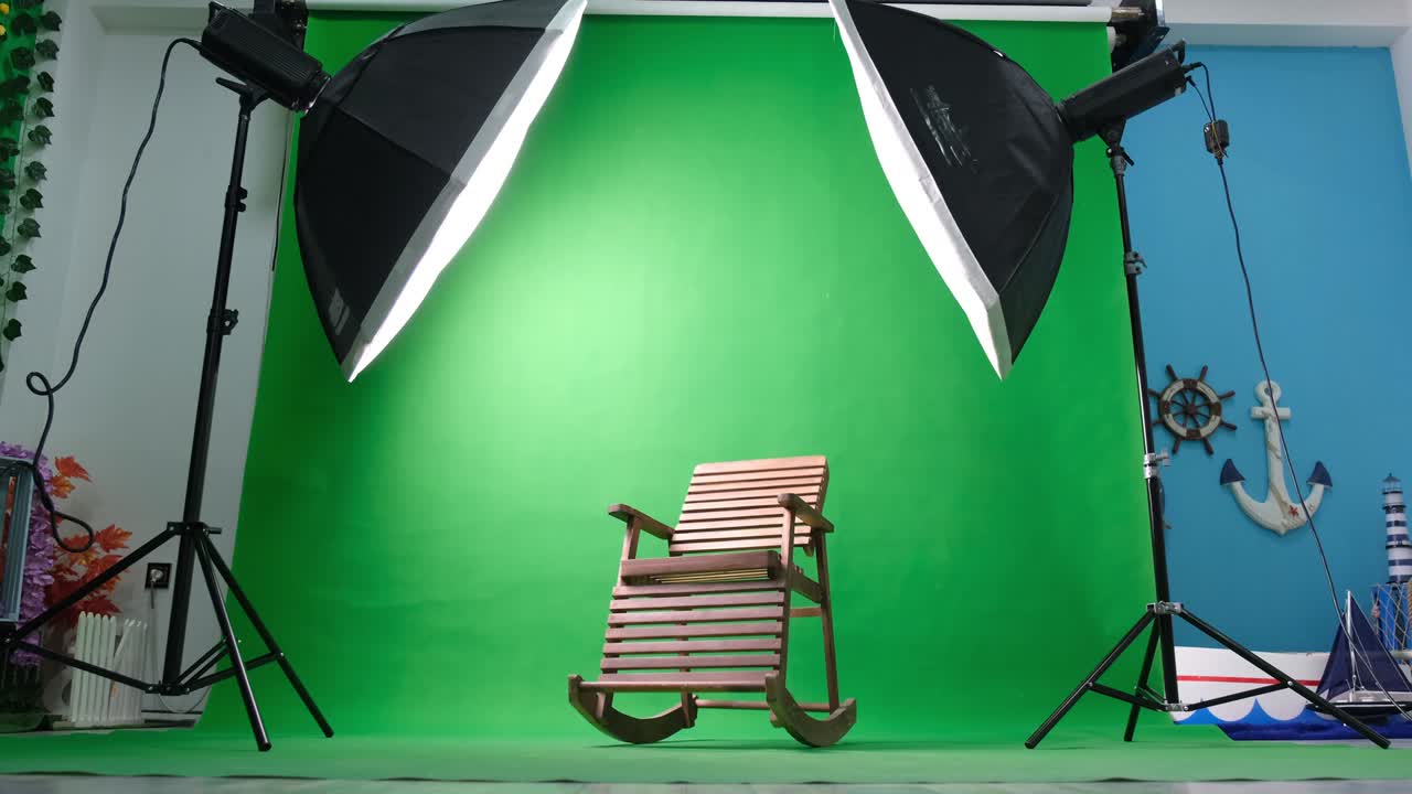 estudio de fotos o video con dos luces de estudio hexagonal. pantalla verde y silla de balanceo