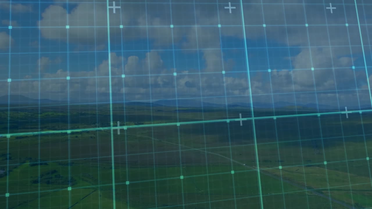 Grid overlay animation over scenic landscape with clouds and fields