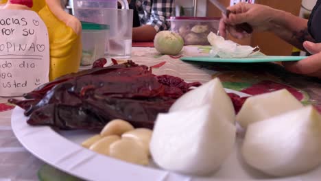 woman prepares ingredients for mexican food