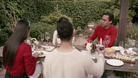 a group of friends having christmas lunch together