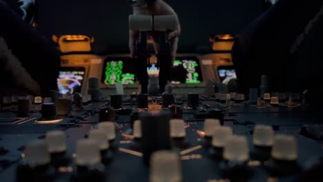 Unique-close-view-of-the-engine-controls-and-flight-instruments-of-a-jet-cockpit-during-night-operation