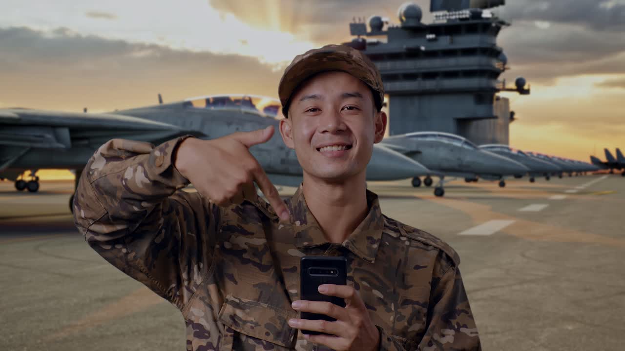 Military Personnel Using Smartphone on Aircraft Carrier