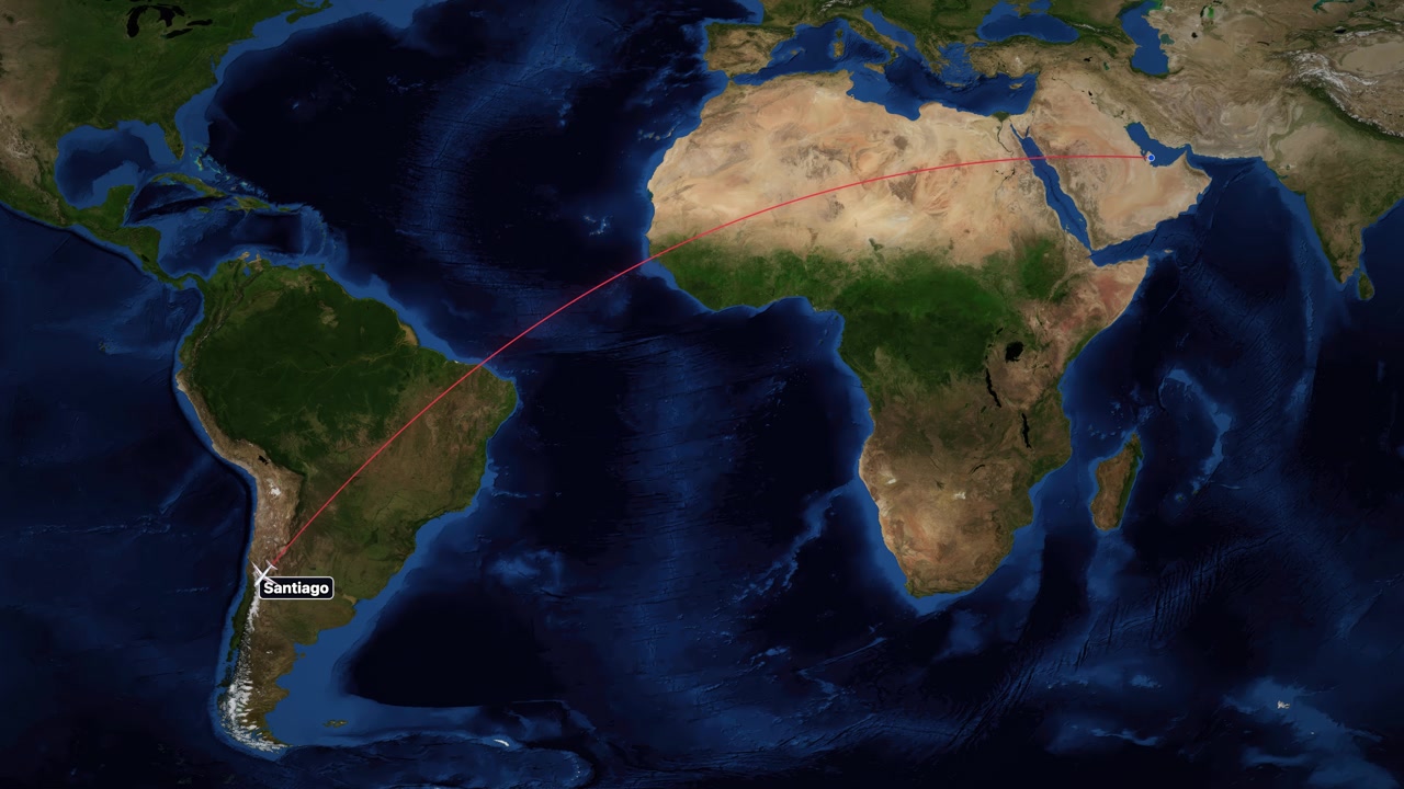 A red line tracks an airplane flying across the world map from Doha to Santiago