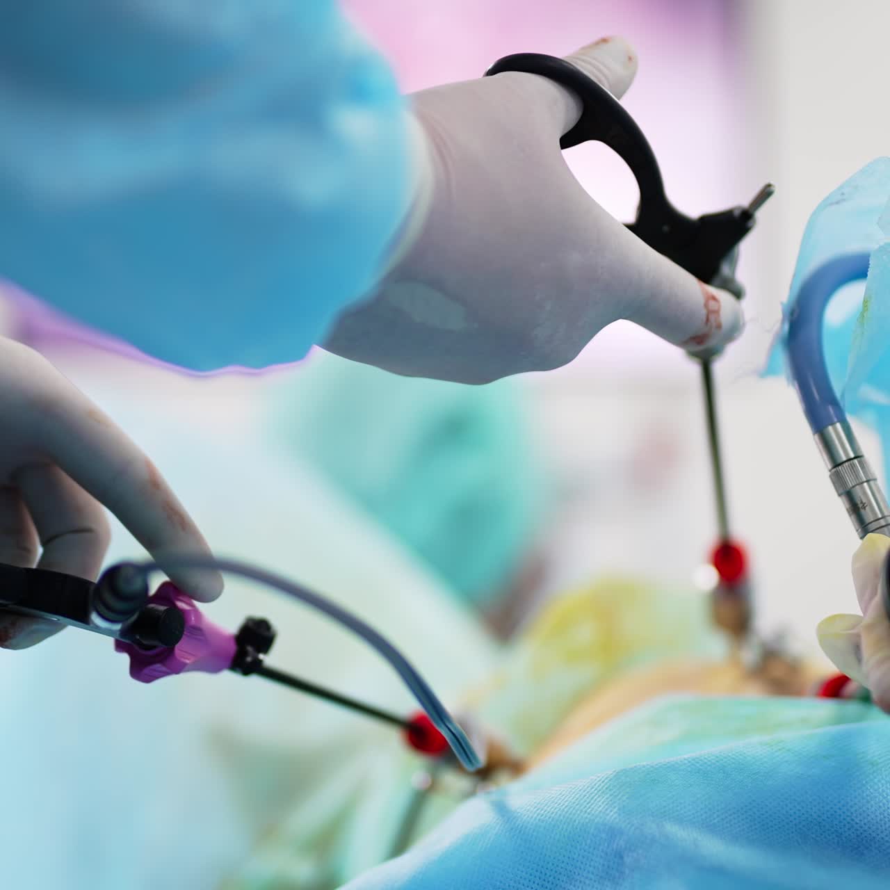 Surgeon's hands in white latex gloves both holding instruments. Professional applying tools at surgery. Close up