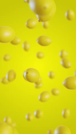 lemons fall on a yellow background. vertical looped video