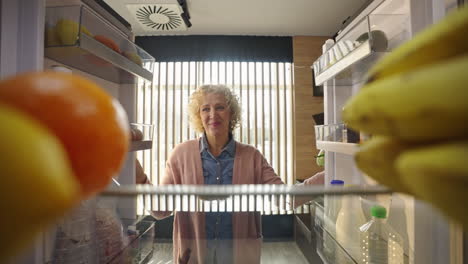woman looking into the refrigerator