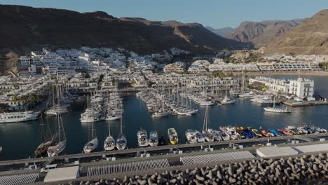 backwards aerial view over the marina of las palmas in smmer time