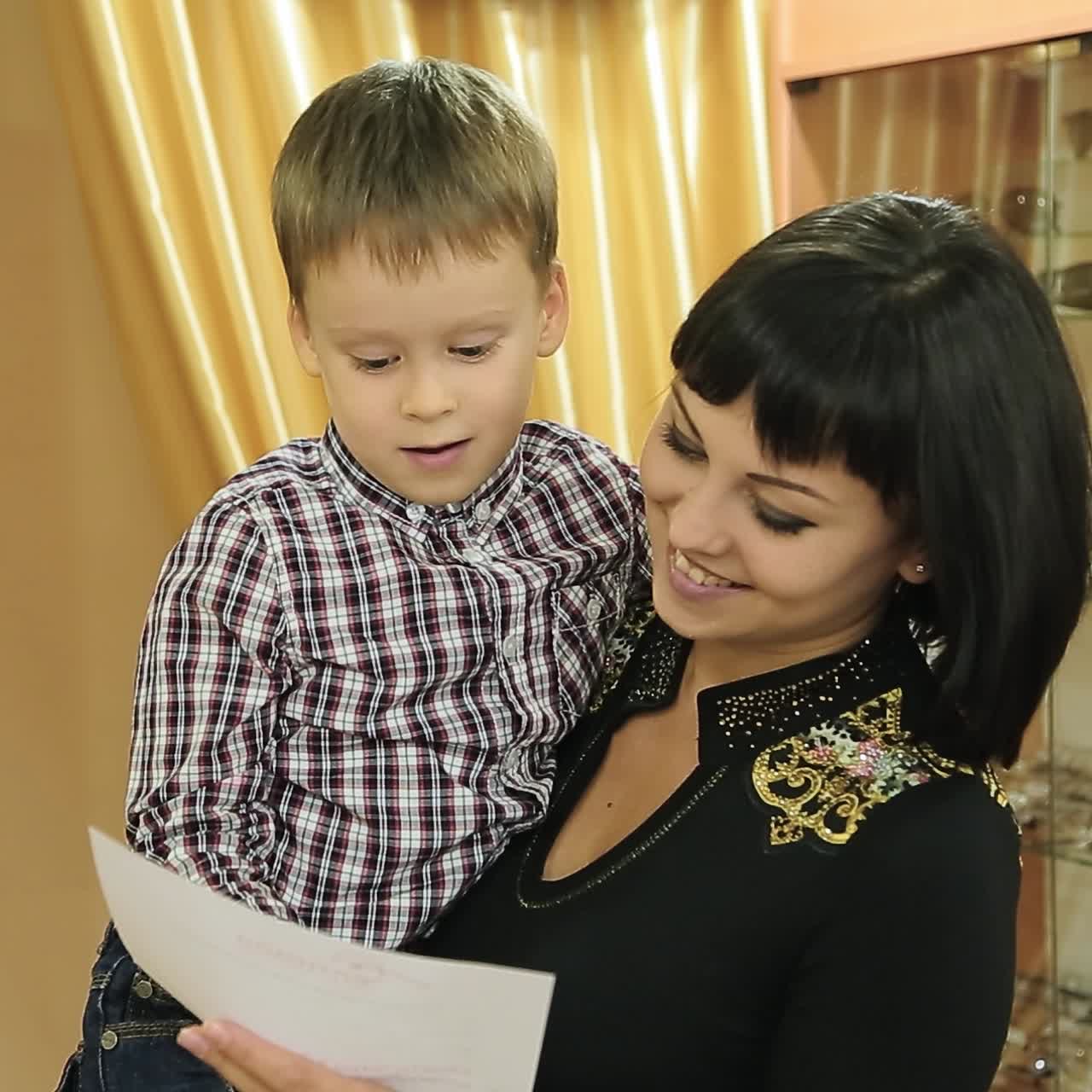 Mother with son in ophthalmology clinic. Optics. ?ptical store.