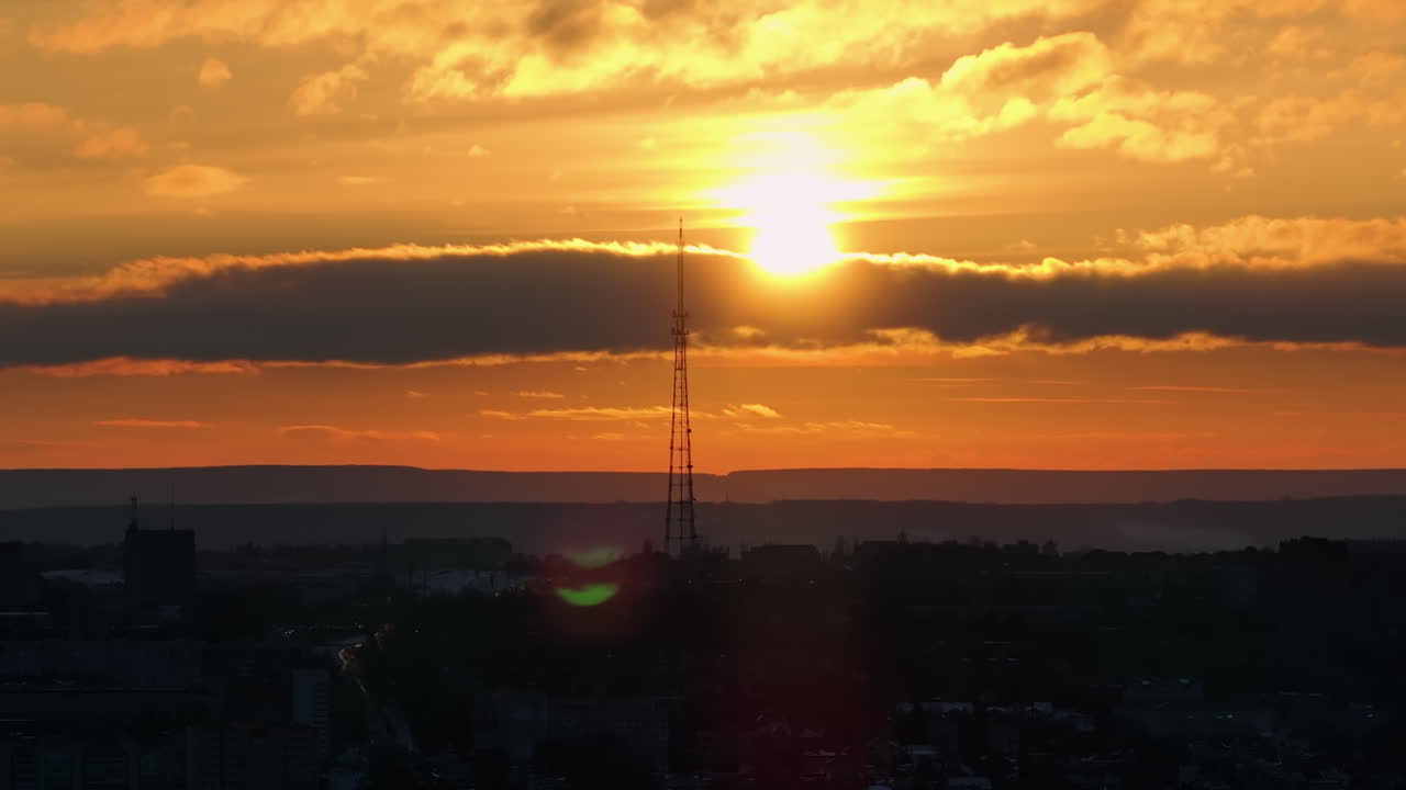 Aerial drone view of Chisinau city at sunset. Radio transmission tower in background. Moldova