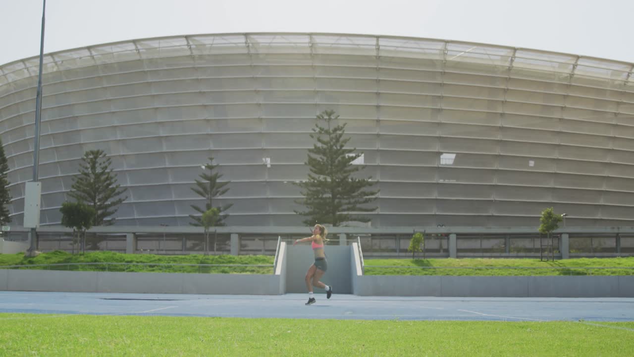 Front view of caucasian athlete throwing javelin