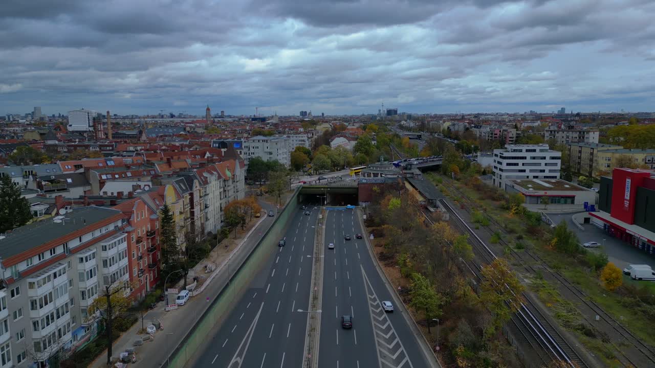 Urban landscape showing a major highway system in Berlin Steglitz with dramatic clouds. Lovely aerial view flight overflight flyover fly push forward drone