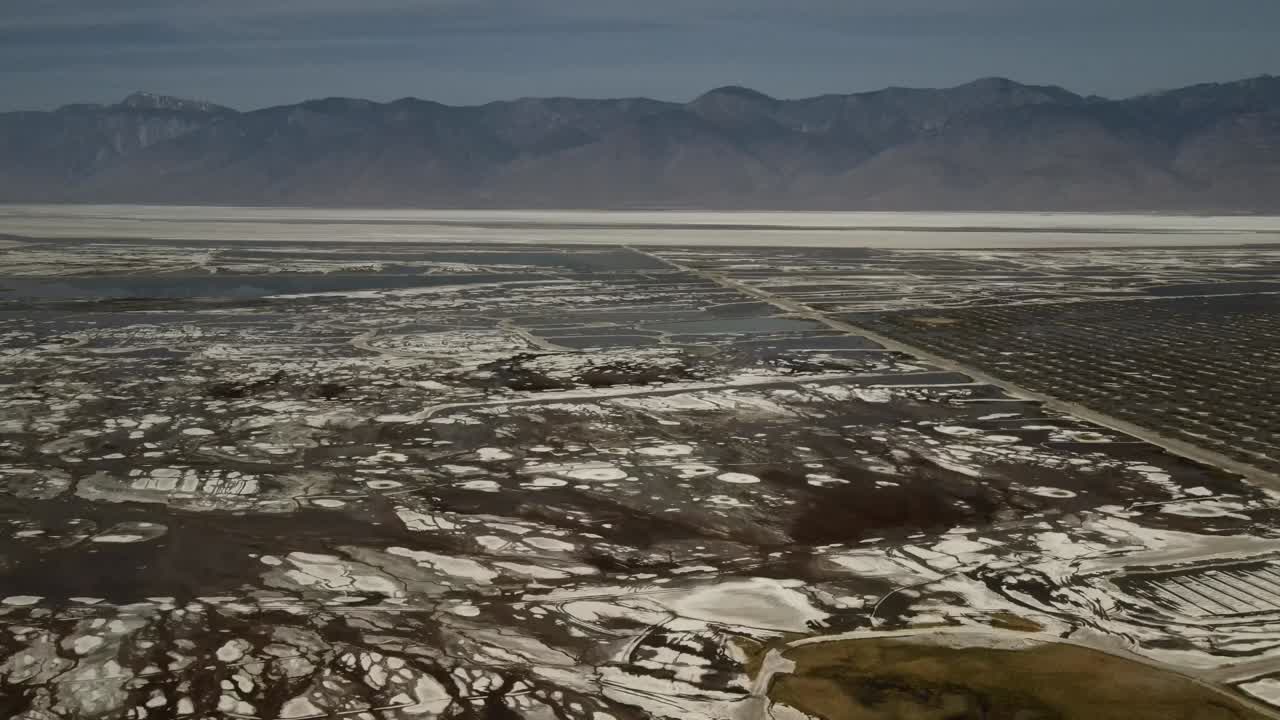 A drone, aerial, cinematic, wide-angle landscape of the Salt Valley National Park