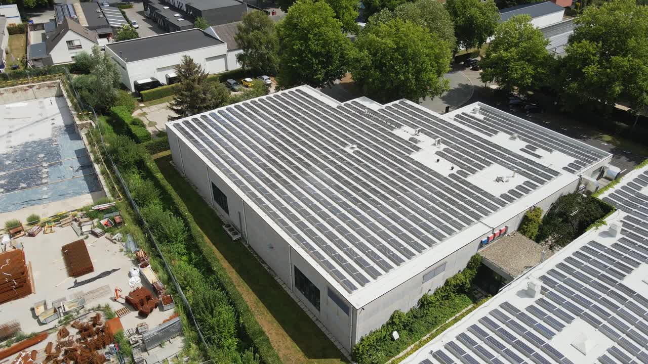Beautiful aerial overview of a rooftop filled with solar panels on an industrial building in Belgium