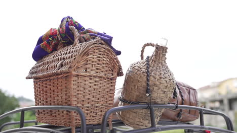 traditional wicker baskets on luggage rack on top of car