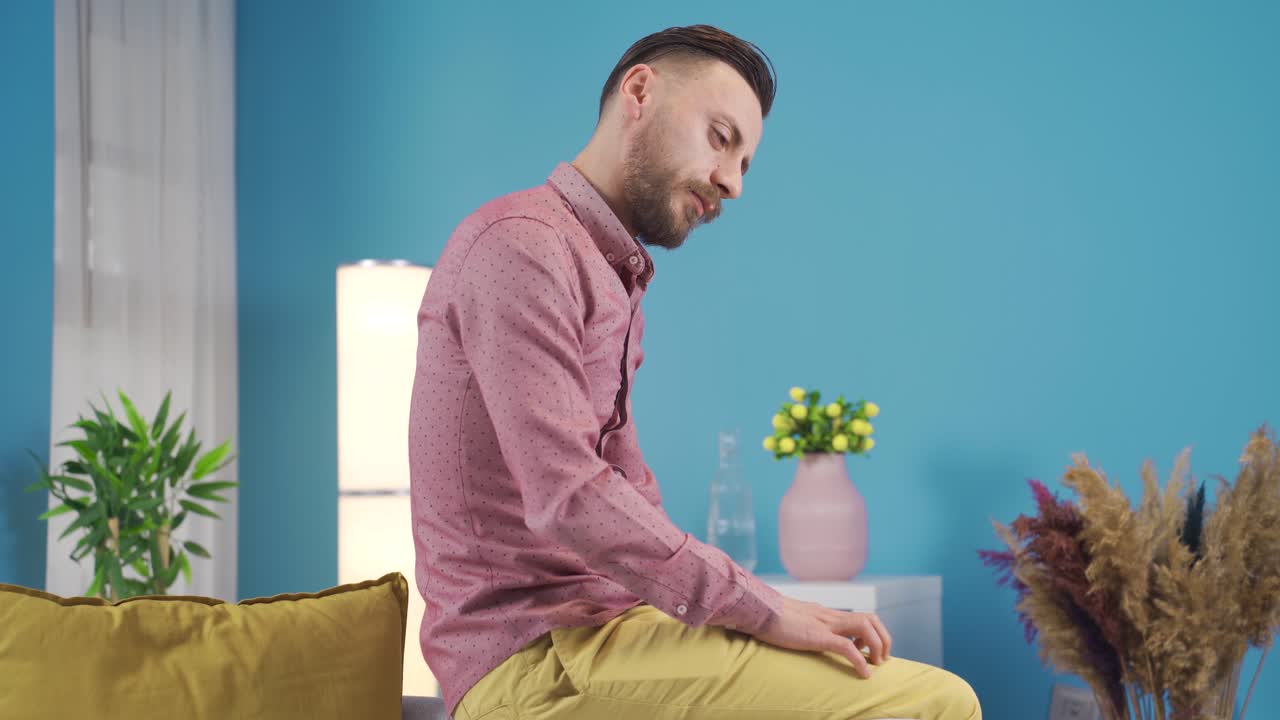 Frustrated offended and helpless man thoughtful at home alone.