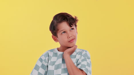 a young boy in deep thought