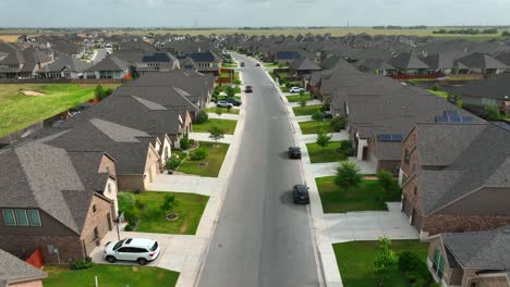 Reverse-aerial-above-homes-in-American-community