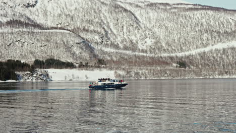 side view of cruise sailing along the norwegian fjords