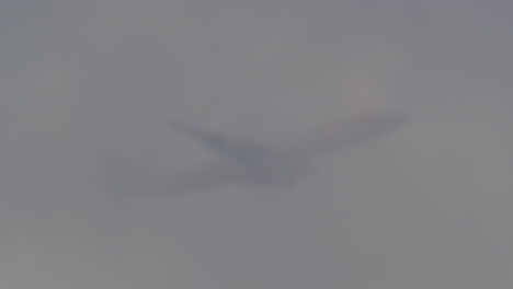 airplane flies through the clouds
