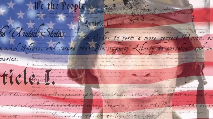 Digital composite video of us constitution text against waving us flag and american soldier