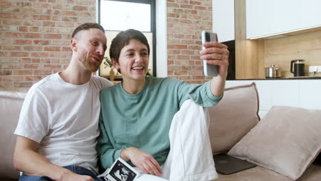 couple doing videocall on the sofa