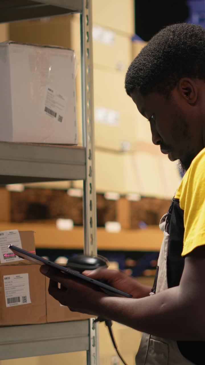 Vertical Video Fulfillment center worker scanning shipping labels to register in inventory