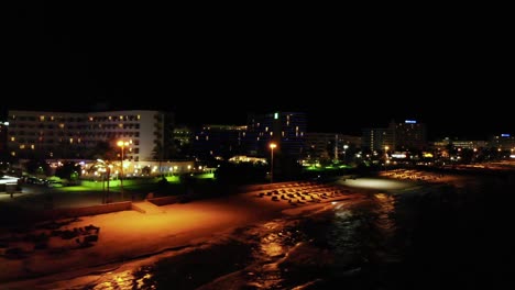 drone pov of mallorca deserted beach at night, spain