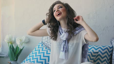 woman enjoying music at home