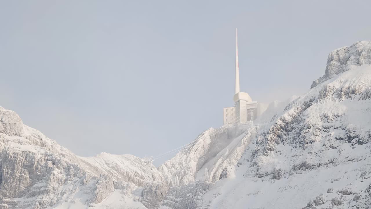 Snowy Mountain Peak with Tower