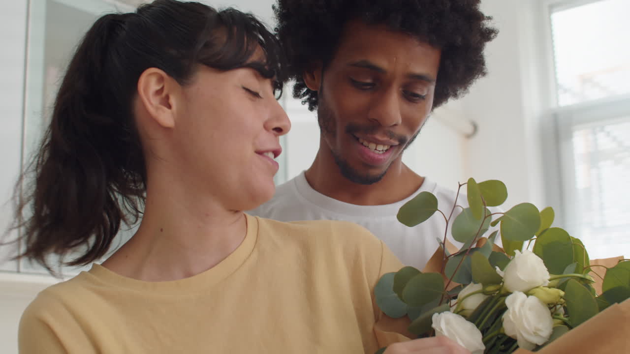 Girl Thanking Her Boyfriend for Beautiful Bouquet and Kissing