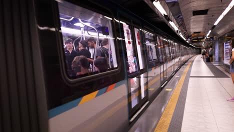 passengers boarding and alighting at naples metro station