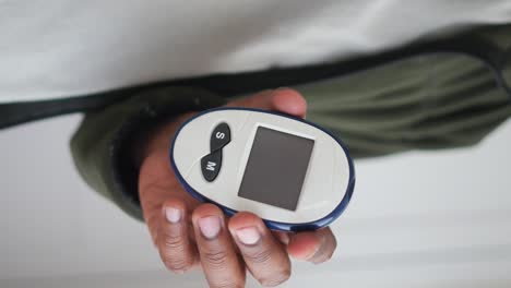 checking blood sugar with a glucose meter