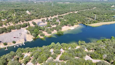 Panning-to-the-right-high-above-an-inlet-for-a-park-on-a-lake