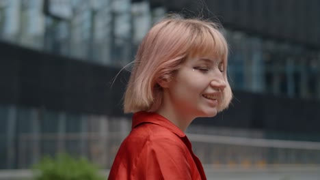 woman in red outfit in a city
