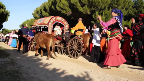 people in traditional costumes dancing outdoors