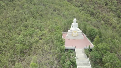 rural town of pai in northern thailand with the mountainside white buddha