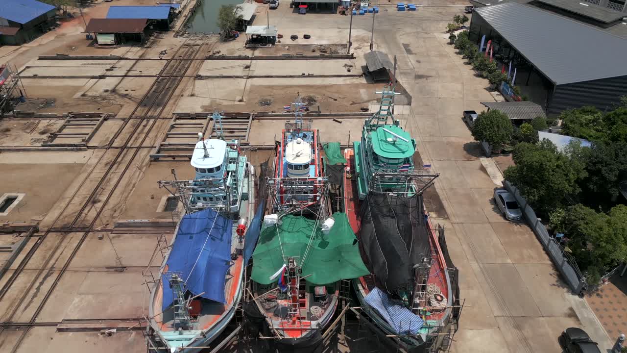 Aerial View of Fishing Boats and a Boatyard at a Southeast Asian Port