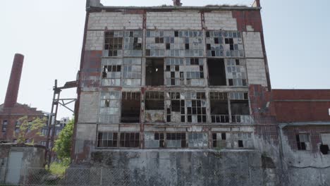 large, abandoned building with broken windows