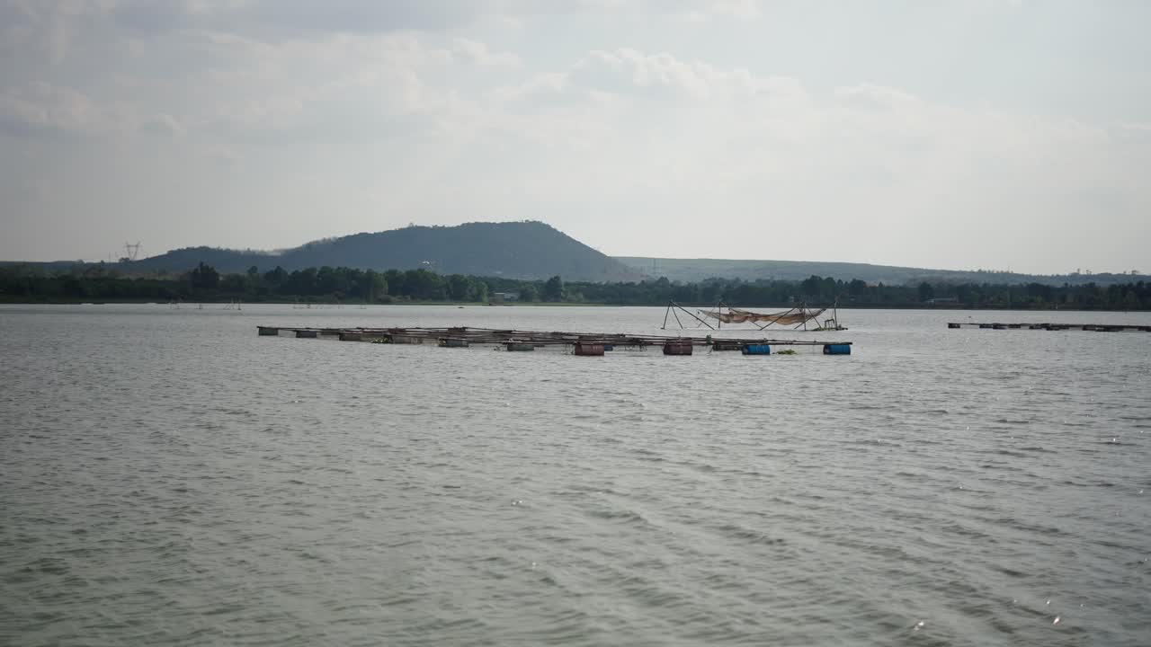 Fish farm with fishing nets on a lake