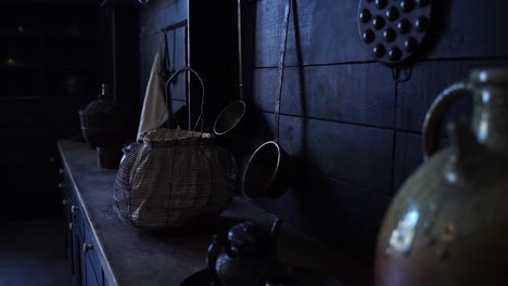 Medieval-dark-monastery-kitchen-with-historical-baskets-other-utensils-on-the-counter