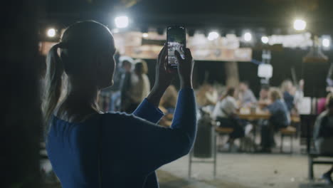 a girl takes pictures on the street